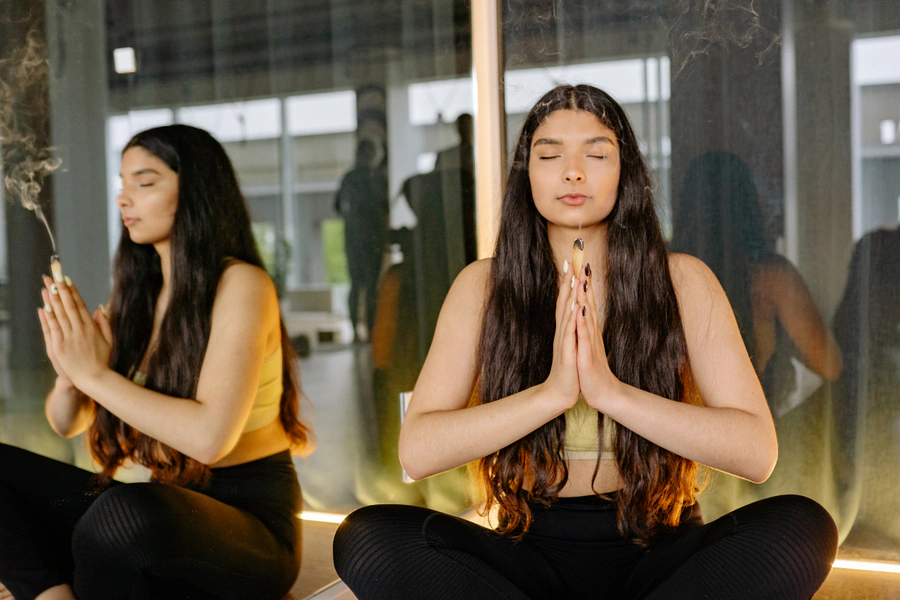 Young person meditating peacefully for stress relief and mental clarity