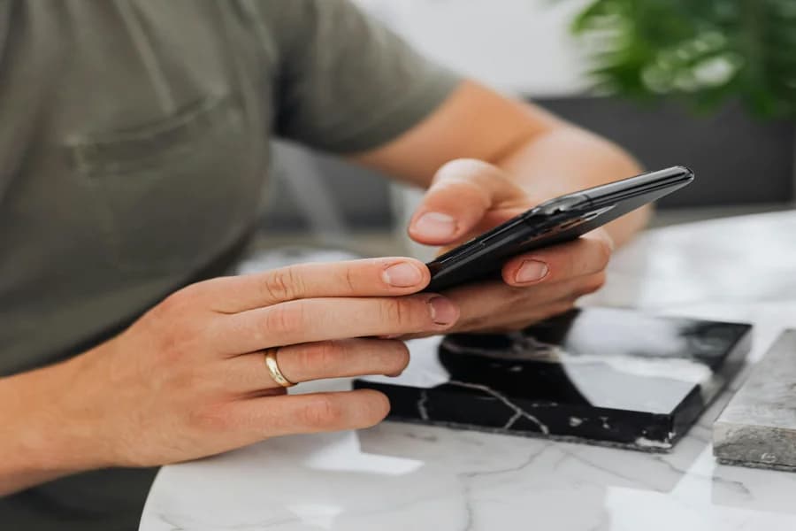 Young adult woman feeling a sense of relief and connection while talking on her phone after an anonymous venting session
