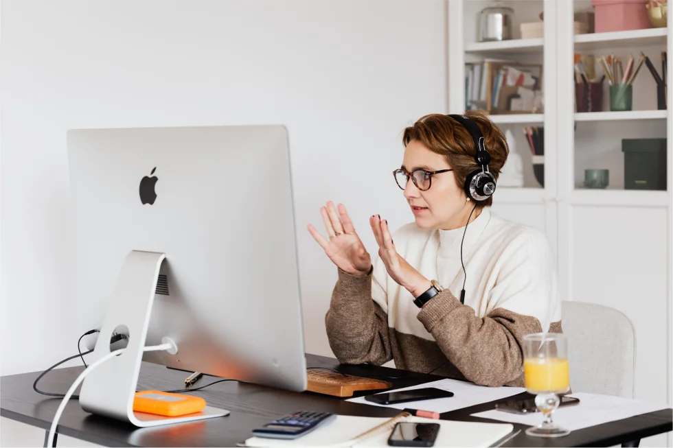 A compassionate therapist and a young adult in a supportive, authentic conversation in a bright office