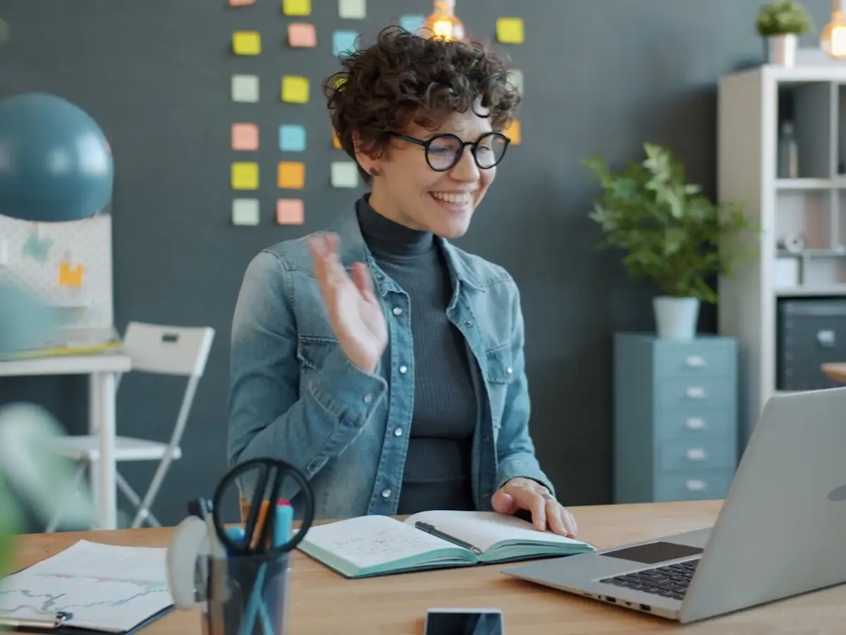 Person smiling warmly during a video call