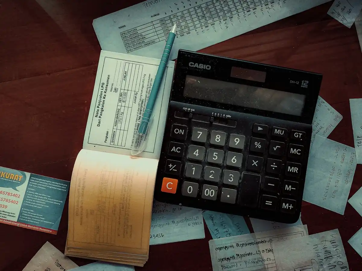 Calculator and notebook used for budgeting