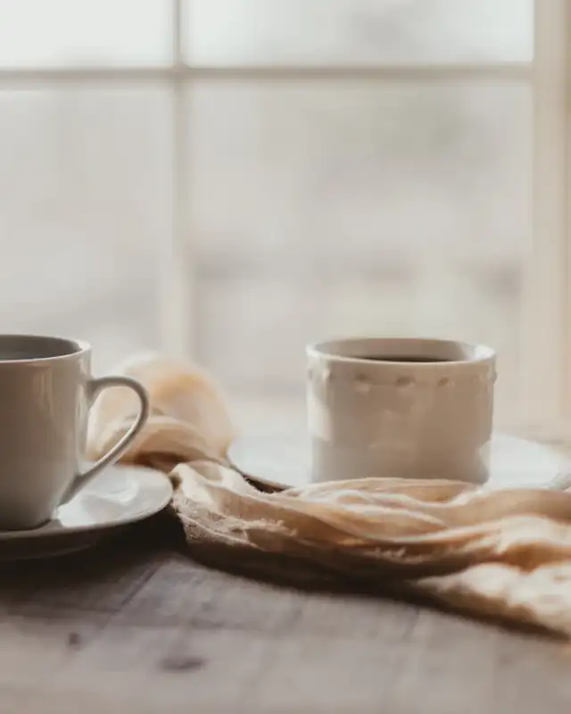 Two coffee cups side by side
